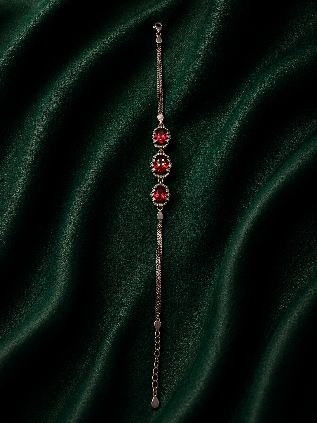 Crimson Elegance Sterling Silver Ruby Oval Halo Bracelet