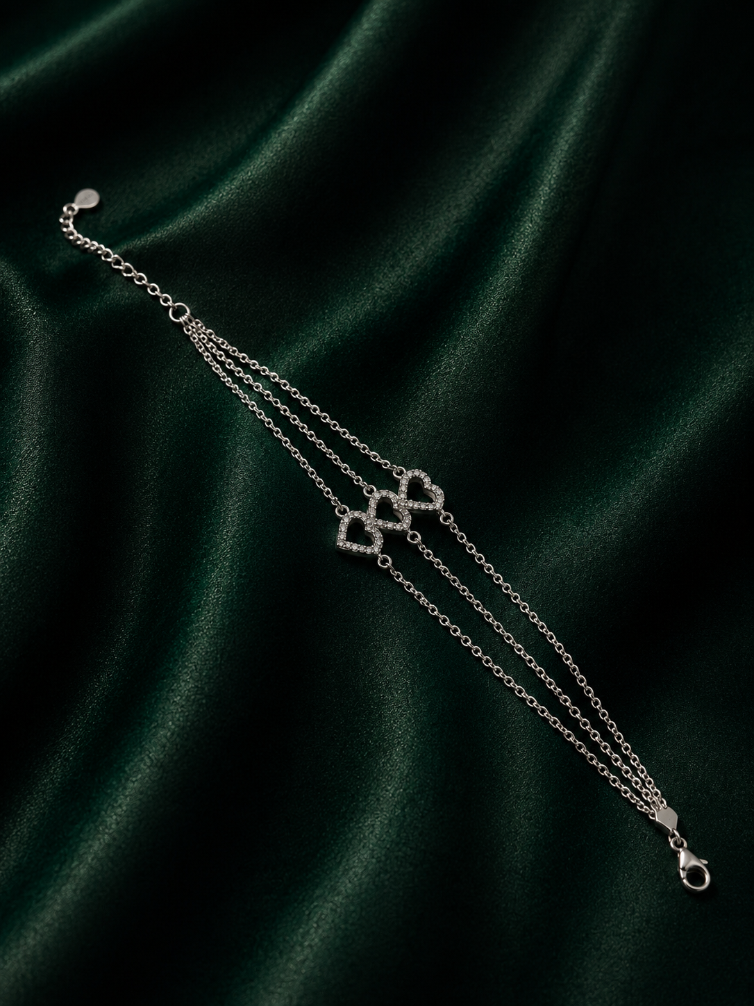 Amara Triple-Strand Silver Heart Bracelet – Pave Crystal Interlocking Hearts