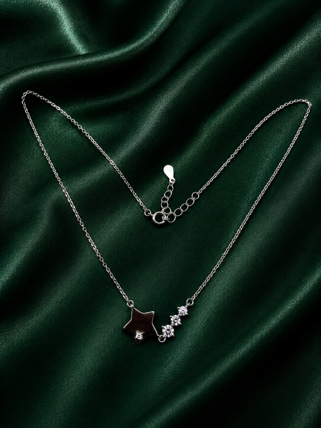 Elegant Silver Shimmering Star and Cascading Crystal Charm Necklace