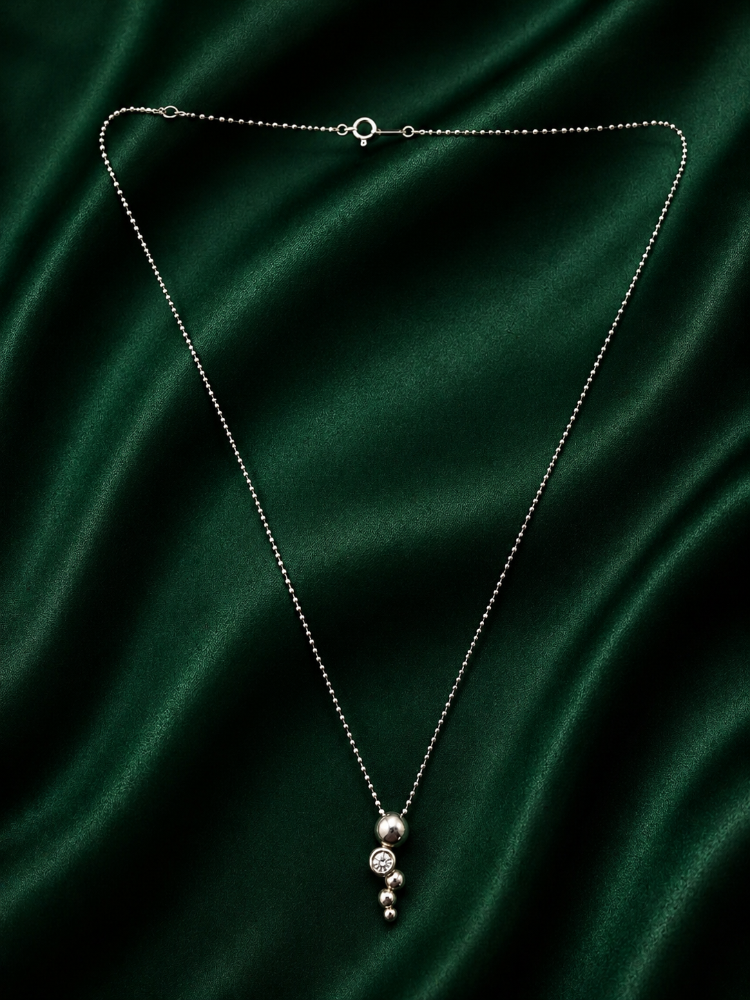Minimalist Silver Cascading Sphere Necklace with Sparkling Crystal Accent